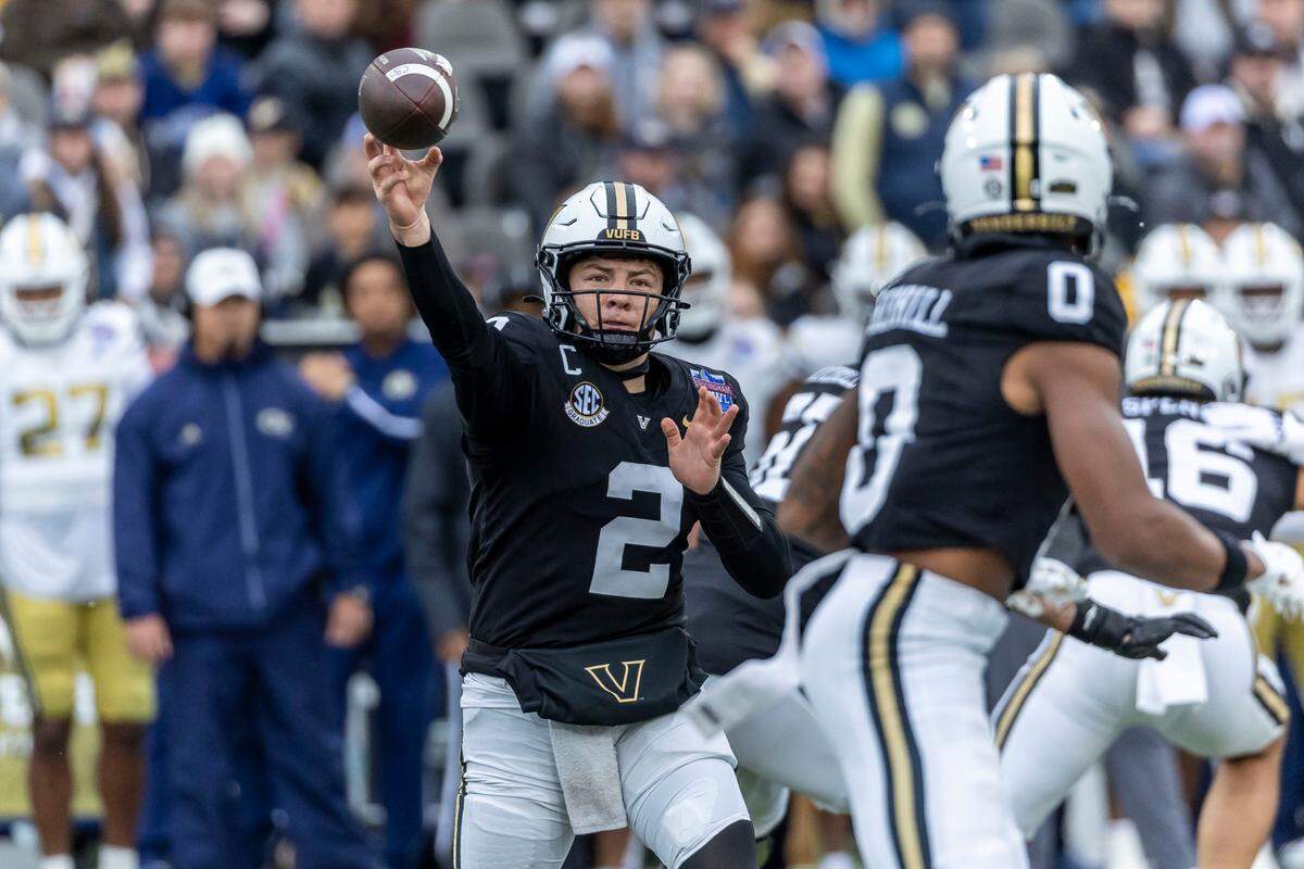 Dec 27, 2024; Birmingham, AL, USA; Vanderbilt Commodores quarterback Diego Pavia (2) throws the ball to Vanderbilt Commodores wide receiver Junior Sherrill (0) during the first half of the 2024 Birmingham Bowl at Protective Stadium.