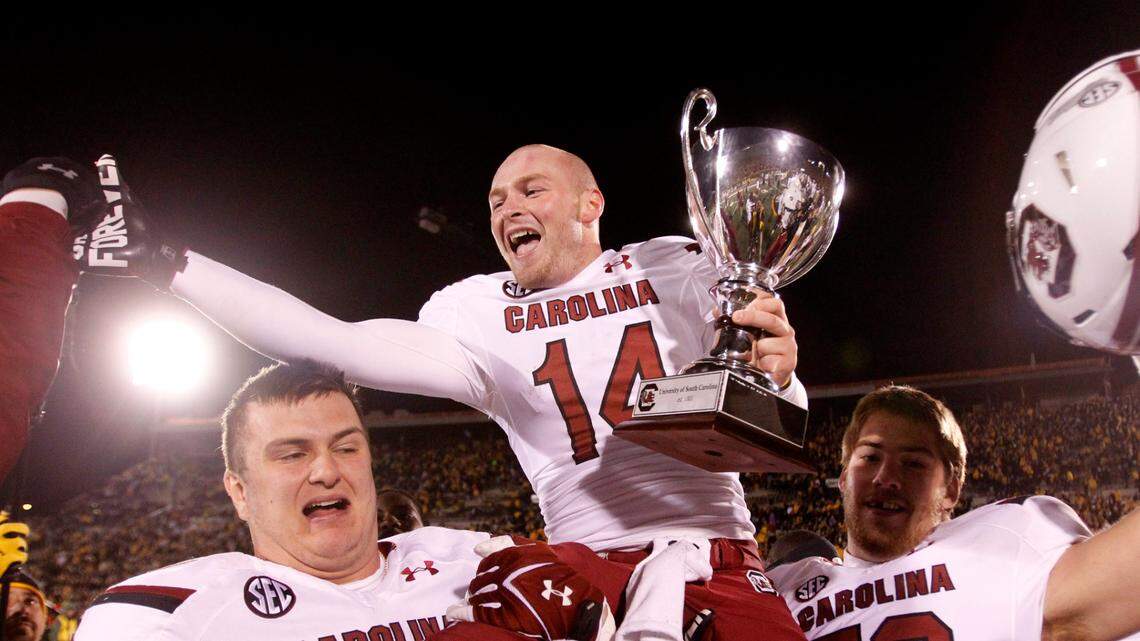 South Carolina Gamecocks quarterback Connor Shaw (14) celebrates with teammates after their win over Missouri at Faurot Field in Columbia, MO.
