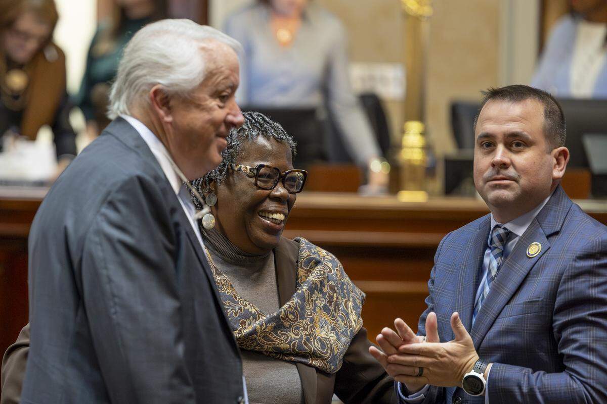 State Rep Gilda Cobb-Hunter, speaks with State Rep. Lee Hewitt, left, and State Rep. Neal Collins during a meeting of the South Carolina House of Representatives on Tuesday, Dec. 3, 2024.