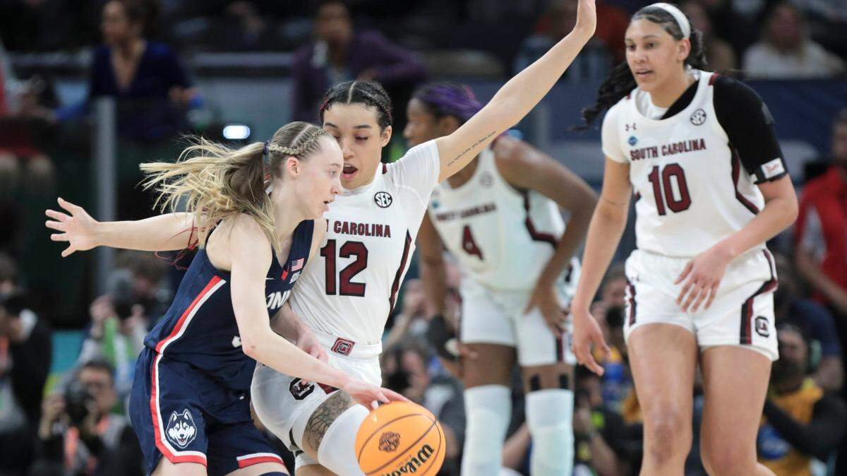 South Carolina’s Brea Beal (12) pressures UConn’s Paige Bueckers (5) during the first half of the national championship game against UConn at the Target Center in Minneapolis, Minn. on Sunday April 3, 2022.