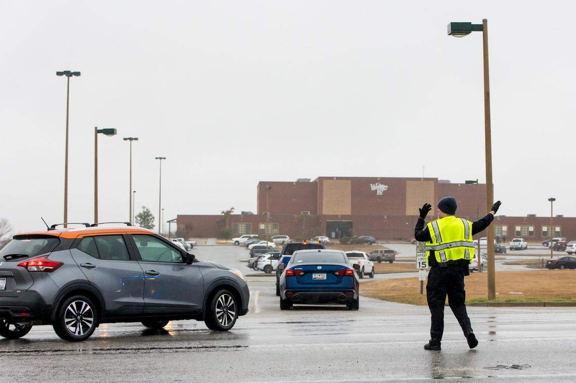 A Lexington County Sheriff’s deputy directs traffic outside White Knoll High School as parents and guardians pick up students Thursday morning after students were sent home due to a threat to the school and several others in the area Feb. 2, 2023.