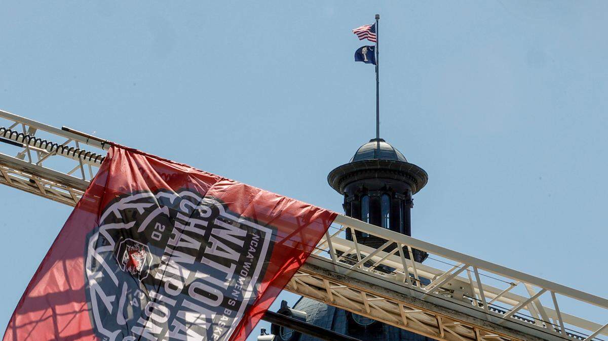 The Columbia fire department raised an American and National Championship flag during a parade through downtown Columbia and a ceremony at the South Carolina State House on Sunday, April 14, 2024. The Gamecocks women’s basketball team won the National Championship after having an undefeated season.