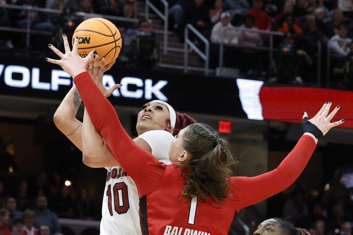South Carolina’s Kamilla Cardoso (10) shoots as NC State’s River Baldwin (1) defends during the Final Four game at Mortgage FieldHouse in Cleveland, Ohio on Friday April 5, 2024.