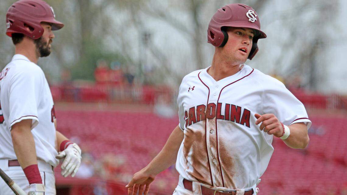 Jacob Olson scores a run in the eight inning of the first game against Valparaiso on Saturday.