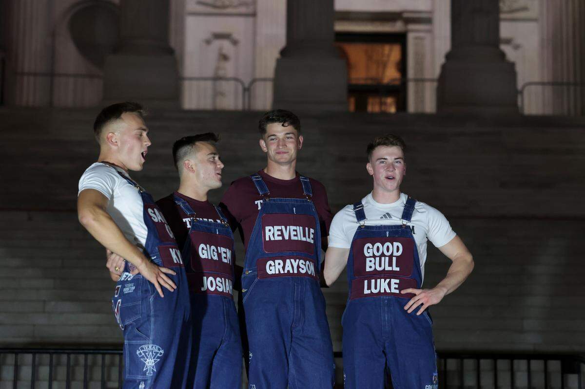 Yell leaders lead Texas A&M fans in the Aggie Yell practice in front of the South Carolina State House on Friday, Nov. 1, 2024. The Gamecocks face the Aggies Saturday at Williams-Brice Stadium.