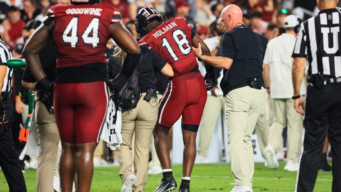 South Carolina defensive back Jaquel Holman (18) is assisted off the field during the game against SC State at Williams-Brice Stadium on Saturday, September 6, 2025.