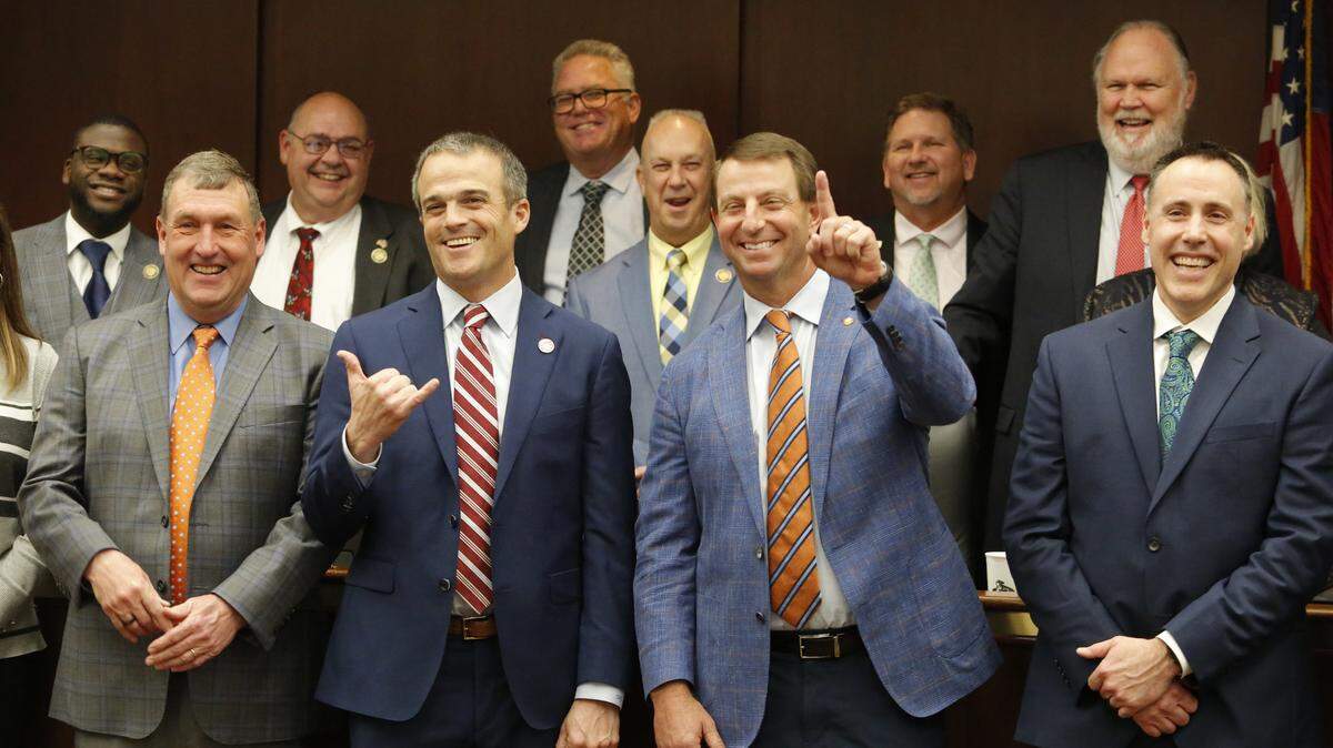 South Carolina head coach Shane Beamer (middle left) and Clemson head coach Dabo Swinney (middle right) during a House Education Full Committee meeting regarding NIL in Columbia, S.C. on Tuesday, Feb. 6, 2024. (Photo by Travis Bell)