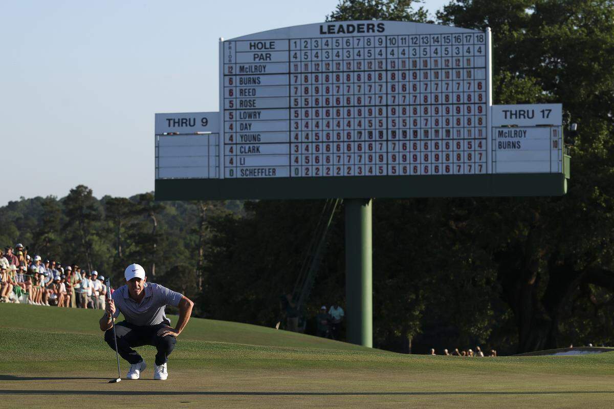 Rory McIlroy of Northern Ireland lines up a putt on the 18th green during the third round of the 2026 Masters Tournament at Augusta National Golf Club.