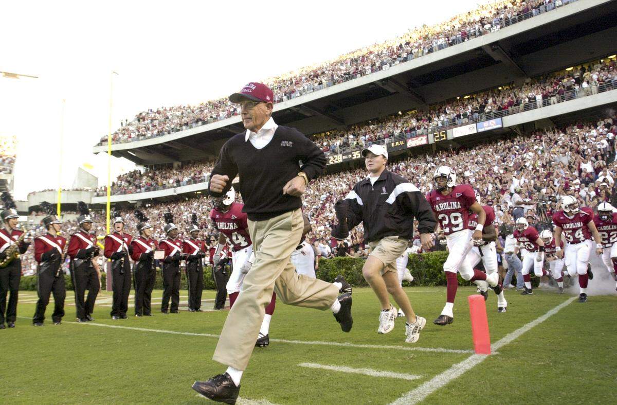 Lou Holtz leads the team onto the field at Williams-Brice Stadium on Sept. 16, 2000, to play Eastern Michigan.