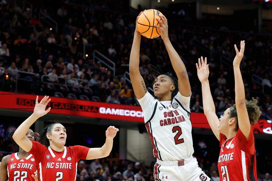 South Carolina’s Ashlyn Watkins (2) pulls down a rebound as NC State’s Mimi Collins (2) and NC State’s Madison Hayes (21) pressure during the Final Four game at Mortgage FieldHouse in Cleveland, Ohio on Friday April 5, 2024.