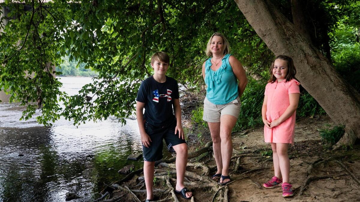 Brooks Nicholson, 12, Sarah Nicholson-Rock and Bella Rock, 6, pose for a portrait near where Sarah, Bella, and family friends entered the Congaree river from the West Columbia Riverwalk Park without flotation devices on Tuesday, May 25, 2021. Sarah and four young girls were rescued by a passing jogger who recently moved to West Columbia and has swam for over half his life and wishes to remain anonymous.