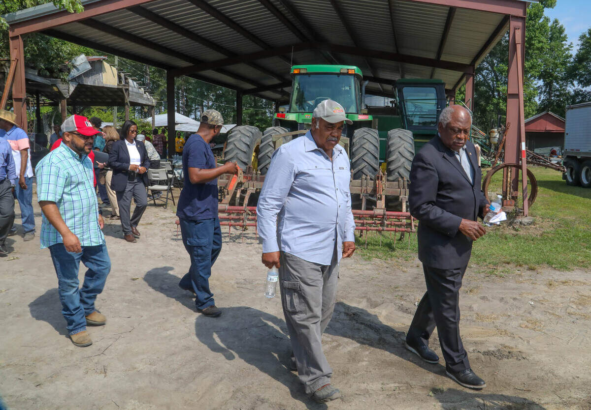 U.S. House Majority Whip James E. Clyburn speaks to farmer Nathaniel Rhoads at his farm in Rowesville, near Orangeburg, S.C. Clyburn and Agriculture Secretary Tom Vilsack announced a new program where FDA loans may be forgiven for socially disadvantaged farmers and ranchers. 5/24/21