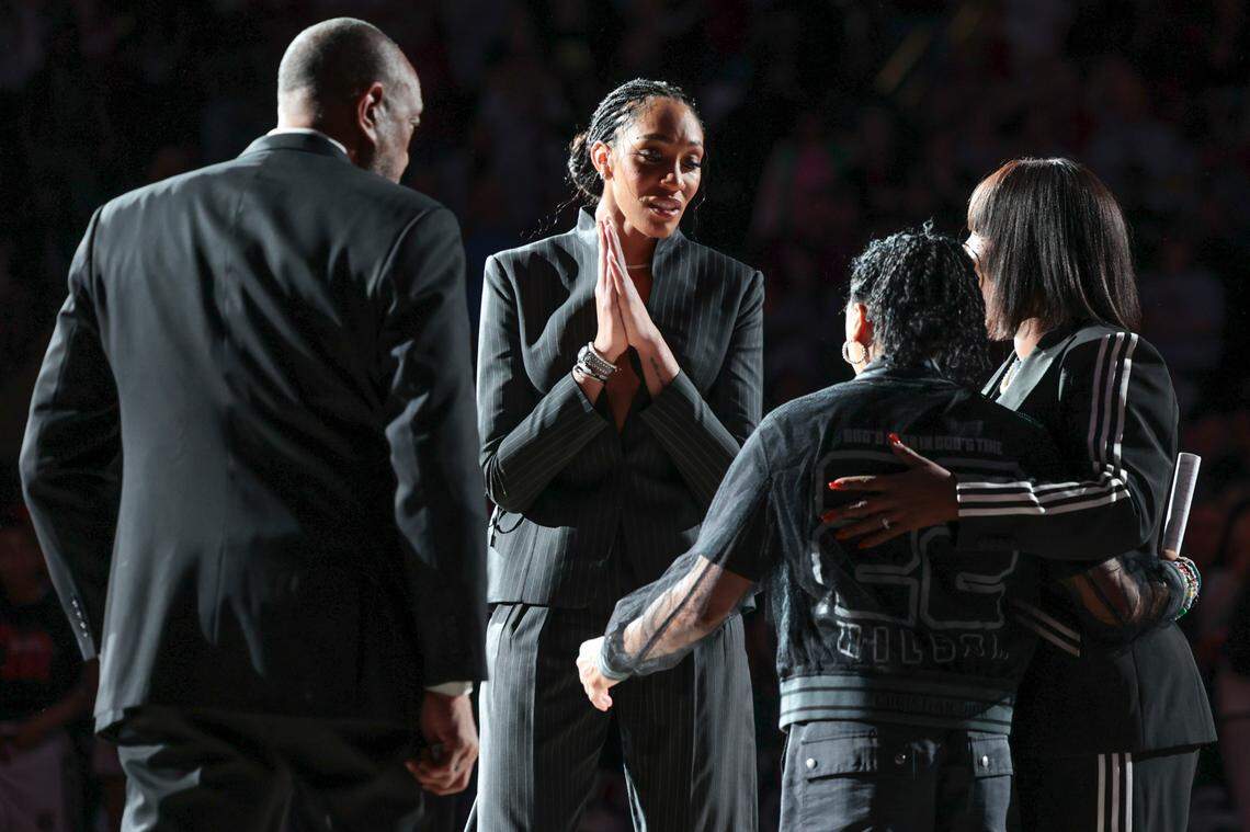 A’ja Wilson, her parents Roscoe and Eva Wilson and USC Coach Dawn Staley gather during a ceremony to retire her jersey and hang it in the Colonial Life Arena on Sunday, Feb. 2, 2025.
