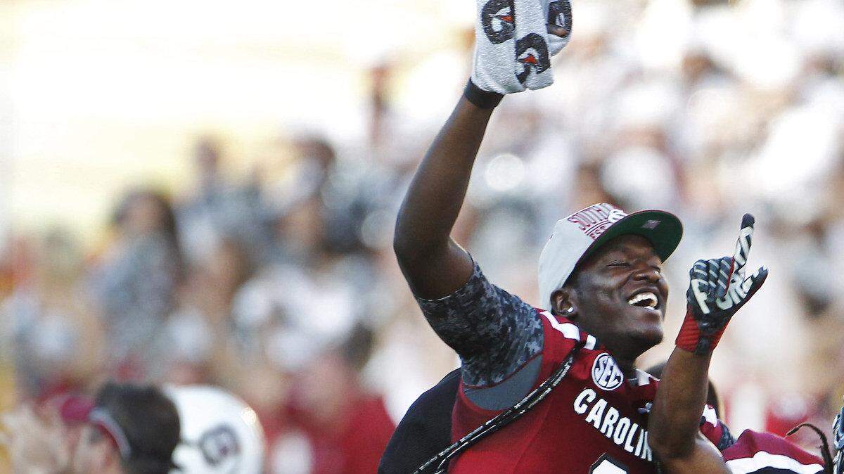 South Carolina Gamecocks wide receiver Ace Sanders (1) celebrates with teammates after Dylan Thompson's touchdown throw in the fourth quarter of the Outback Bowl at Raymond James Stadium.
