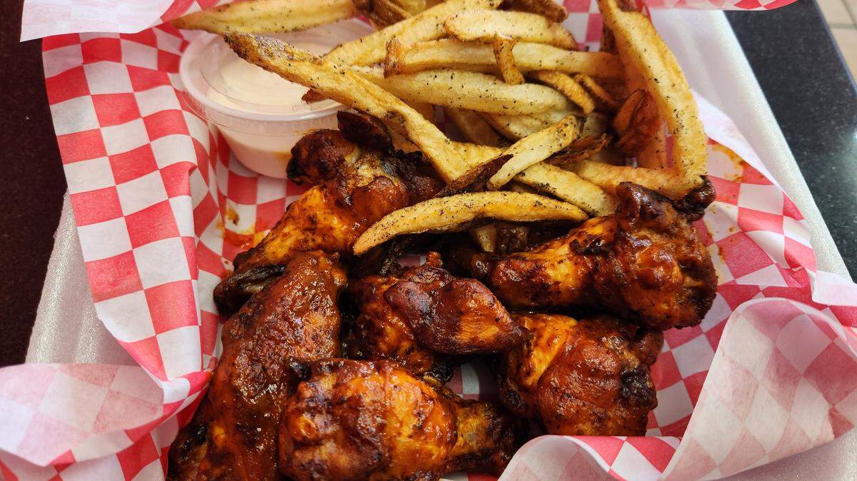 An order of original wings and fries from Wing Man at 711 Main St. in Lexington.