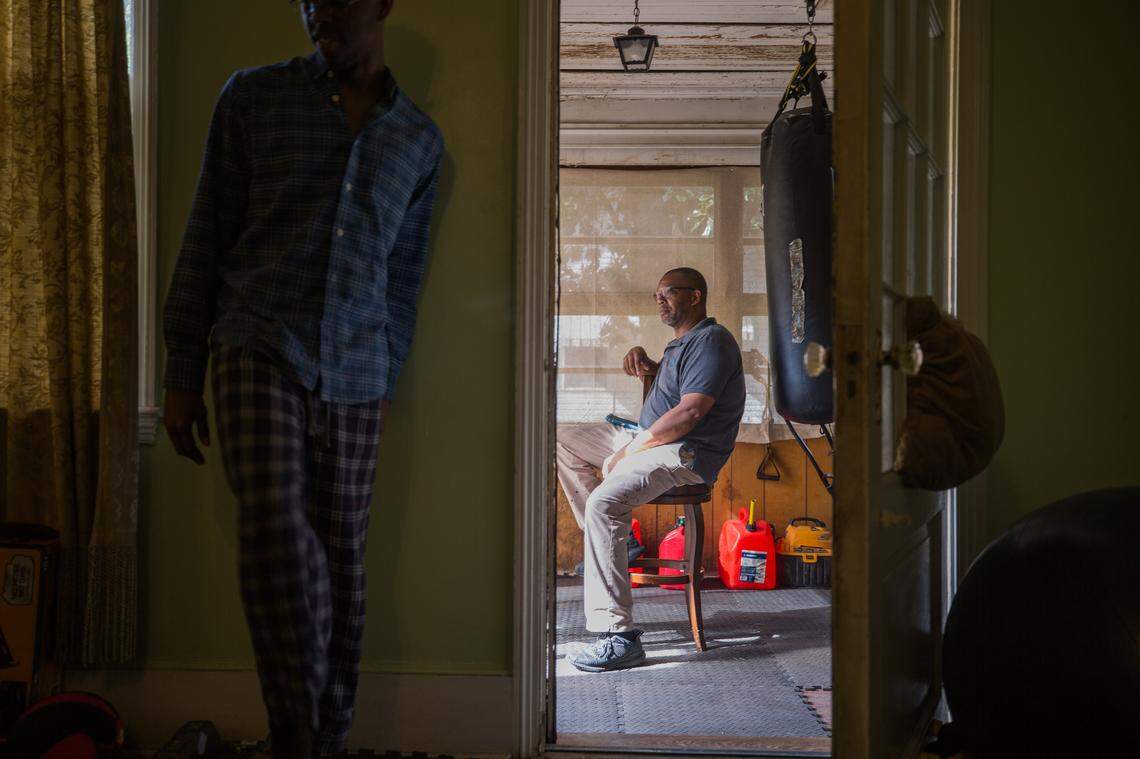 Steven Nelson and his son, Sean, at his home in Sumter.
