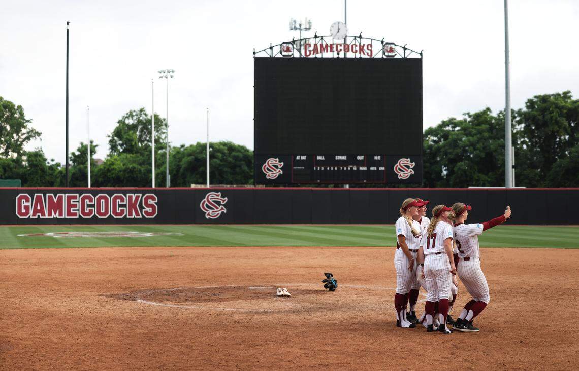 South Carolina players take a selfie on the field following the Gamecocks’ loss to UCLA at Carolina Softball Stadium in Columbia on Sunday, May 25, 2025.