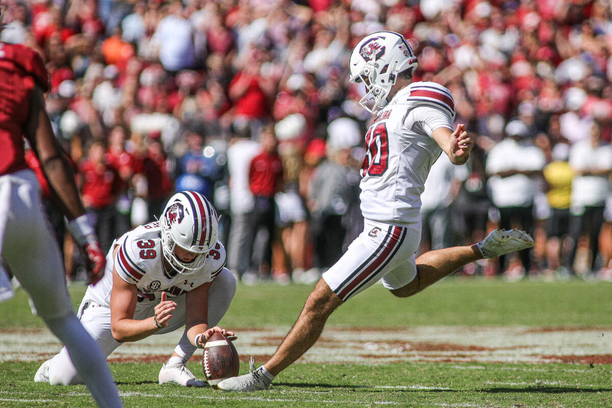 South Carolina’s Alex Herrera attempts a kick during Saturday’s game against Alabama at Bryant-Denny Stadium in Tuscaloosa.