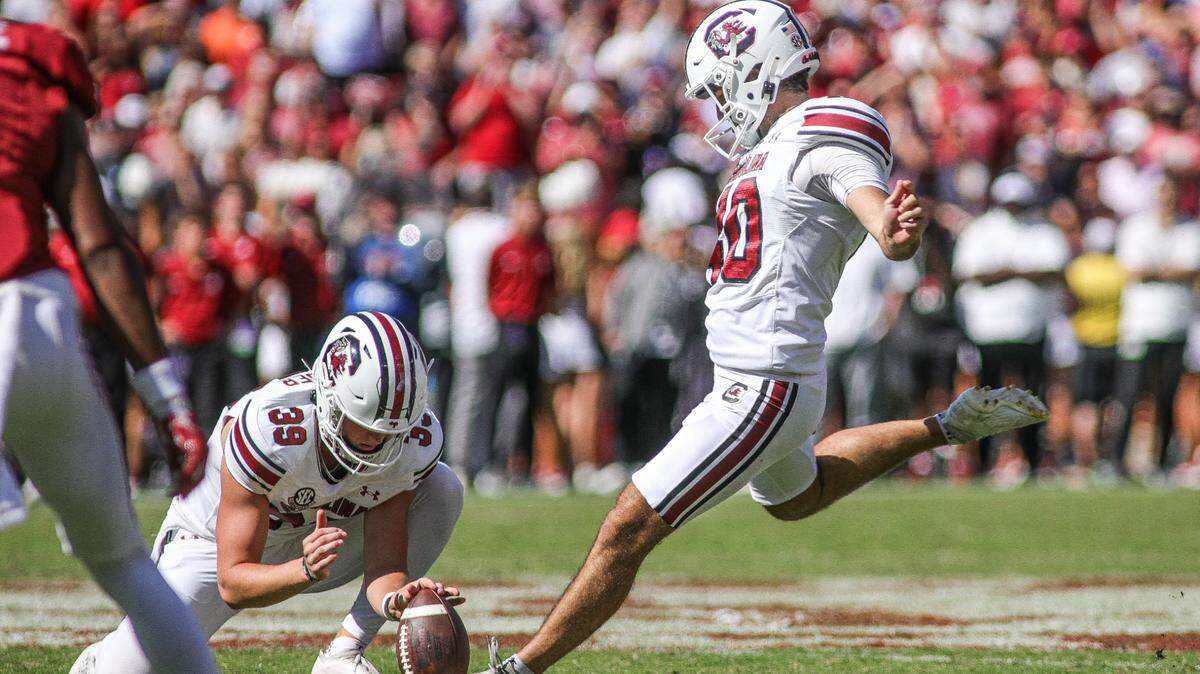 South Carolina’s Alex Herrera attempts a kick during Saturday’s game against Alabama at Bryant-Denny Stadium in Tuscaloosa.