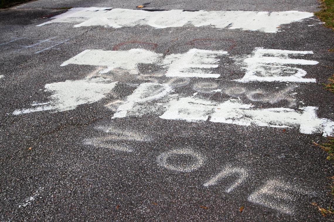 Vandalism with a mix of messages, some in support of President Donald Trump’s reelection, in front of Marie Perry’s home on Friday, October 23, 2020.