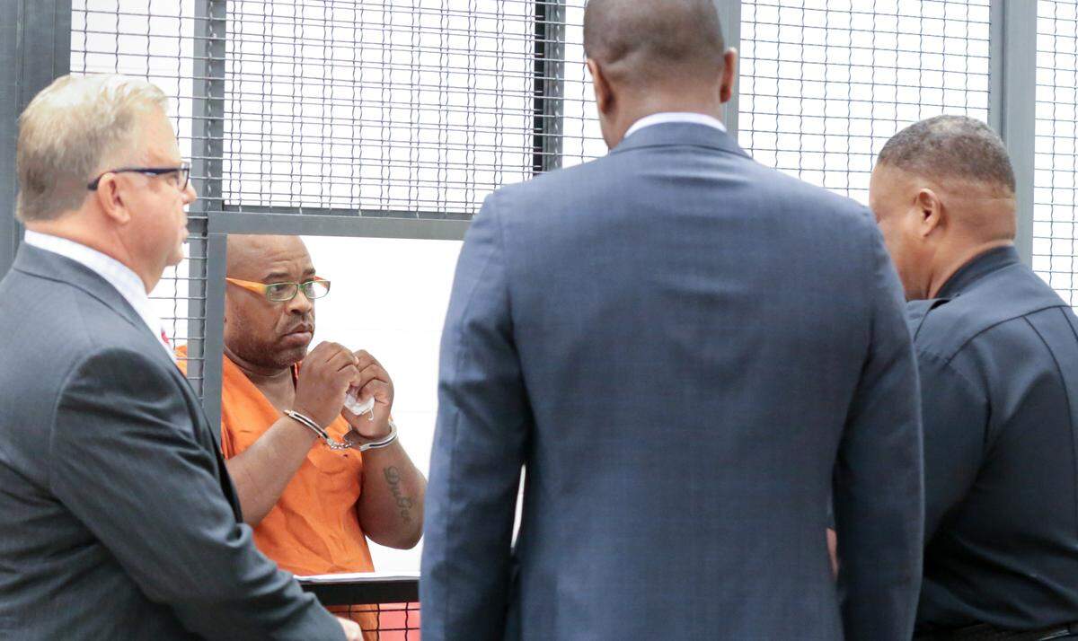 Randy Scott talks with his attorneys, Bakari Sellers and Pete Strom, during a bond hearing at Alvin.S. Glenn Detention Center. Scott was charged after finding what appears to be drugs in his home.