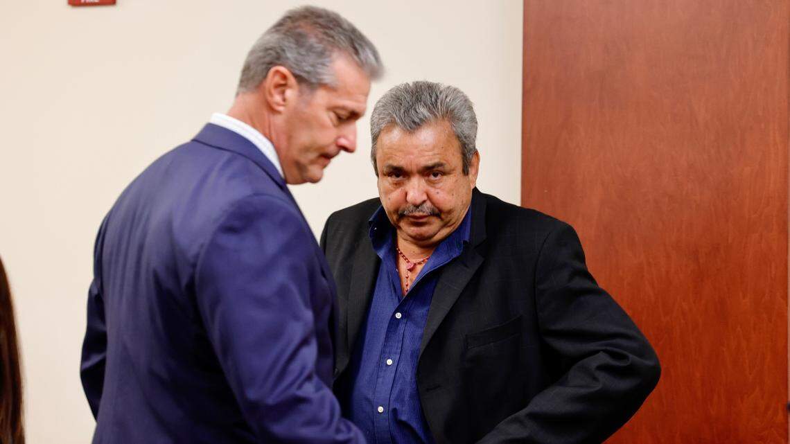 Attorney Eric Bland speaks with Greg Leon, right, in a Lexington County courtroom on Monday, July 18, 2022.