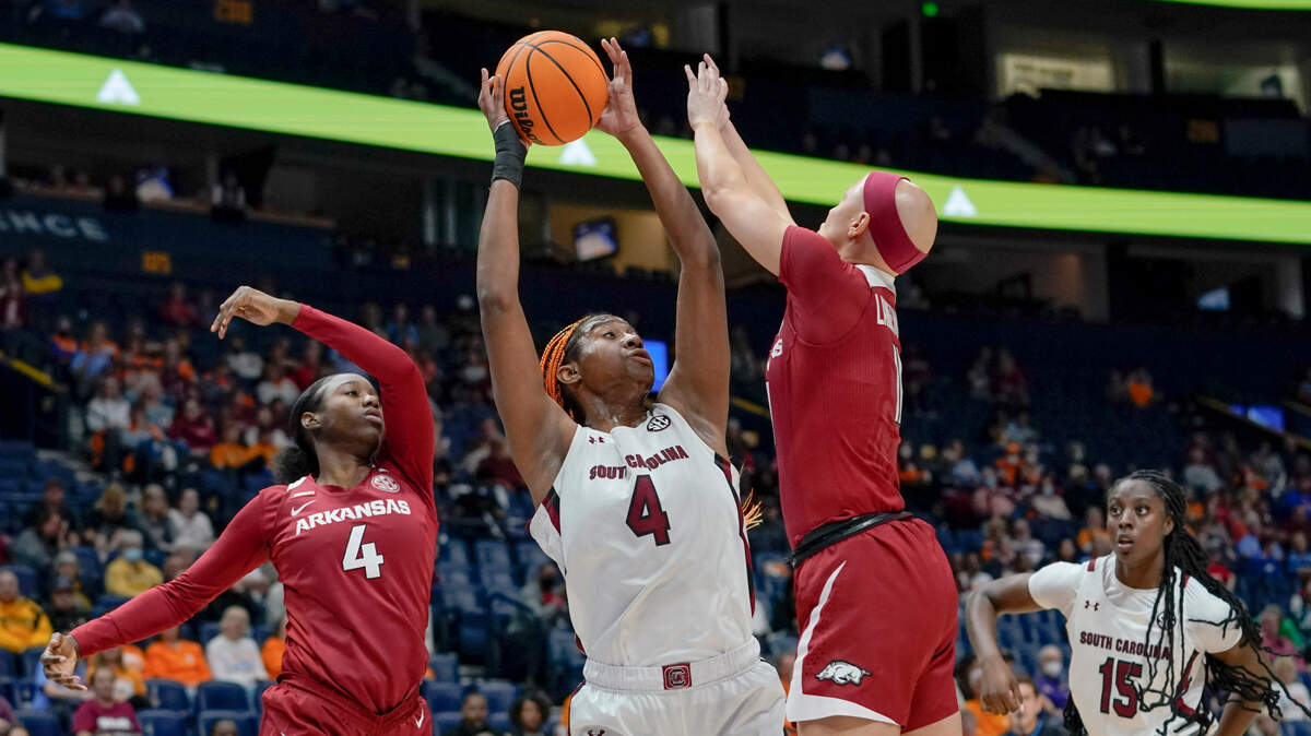 South Carolina’s Aliyah Boston, center, grabs a rebound between Arkansas’ Erynn Barnum, left, and Rylee Langerman in the first half of an NCAA college basketball game at the women’s Southeastern Conference tournament Friday, March 4, 2022, in Nashville, Tenn. (AP Photo/Mark Humphrey)