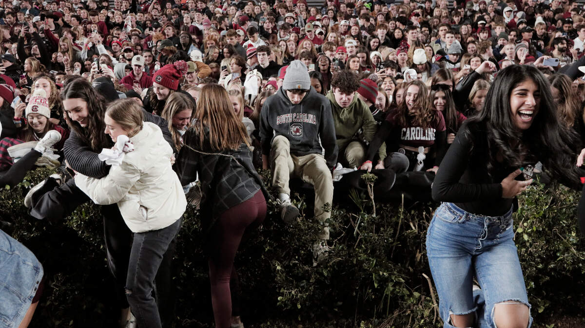 South Carolina fans rush the field after defeating Tennessee on Saturday, November 19, 2022.