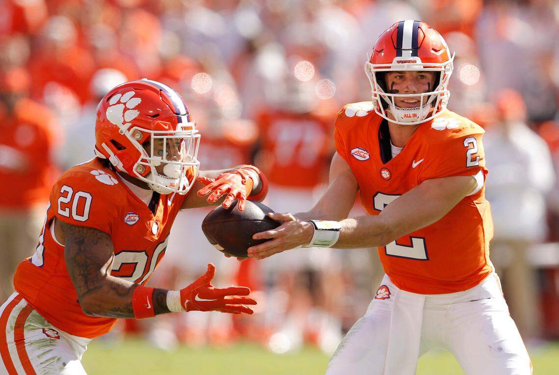 Clemson running back Domonique Thomas (20) takes a hand off from Clemson quarterback Cade Klubnik (2) against Notre Dame during first-half action in Clemson, S.C. on Saturday, Nov. 4, 2023. (Travis Bell/SIDELINE CAROLINA)