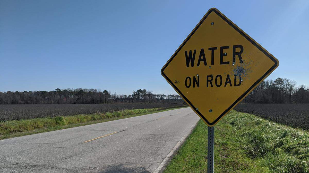 This photo, taken March 6, 2020, shows a “Water on Road” sign at a street running through the Columbia Venture property. The University of South Carolina may purchase this land to build intramural fields.