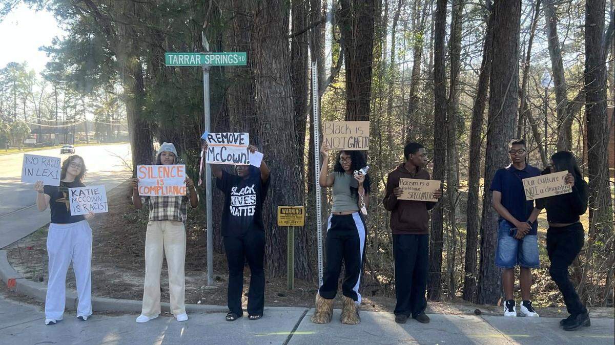 Parents and students protested outside a Lexington 1 school board meeting on March 9, 2026, after a board member criticized a Black History Month fashion show at River Bluff High School.