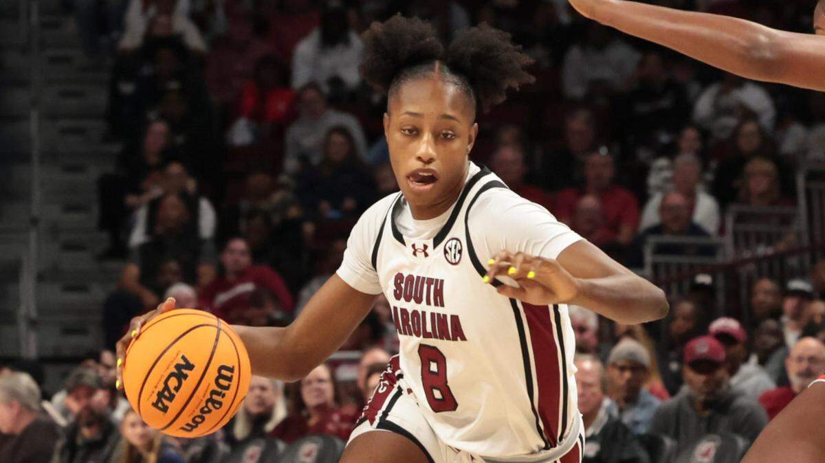 University of South Carolina’s  Joyce Edwards (8) drives around Auburn’s Taylen Collins (14) during the second half of action in the Colonial Life Arena on  Sunday, Feb. 2, 2025.