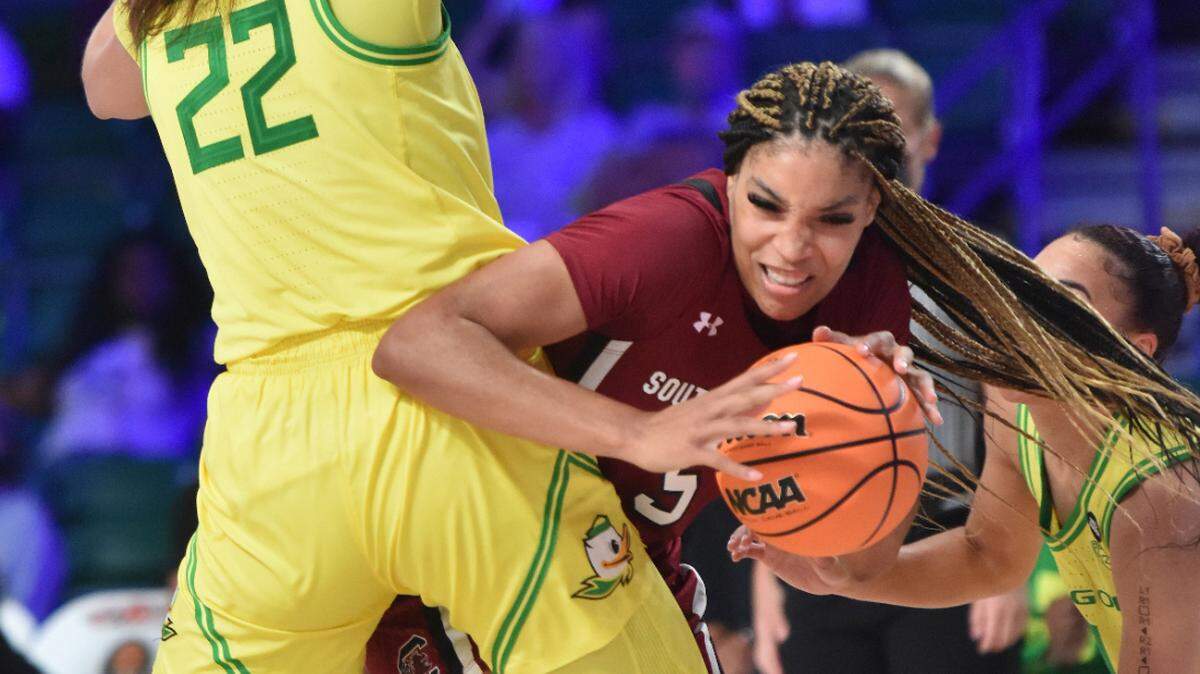South Carolina forward Victaria Saxton (5), right, is defended by Oregon forward Kylee Watson (22) during an NCAA college basketball game at Atlanta Paradise Island in Nassau, Bahamas, Sunday, Nov. 21, 2021.