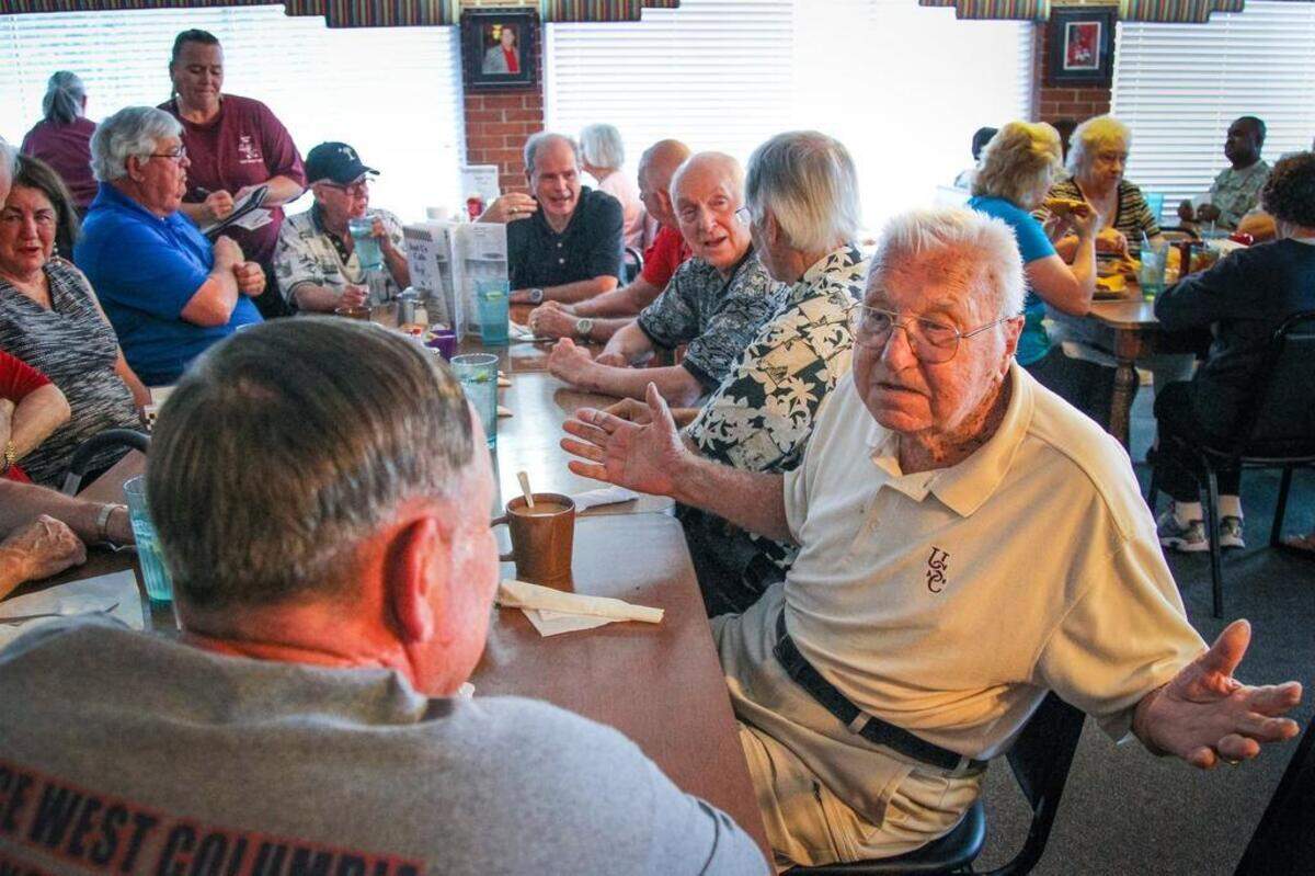 Longtime midlands prep coach Cy Szakacsi, has lunch in 2014 with a dozen or so of his former players in 2014.. Szakacsi played at South Carolina and coached at University High, A.C. Flora and Heathwood Hall during his career.
