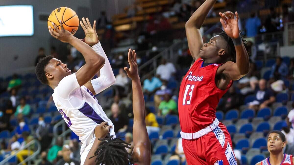 Ridge View Blazers Gregory GG Jackson (23) attempts to shoot over Fort Dorchester Patriots Demetris McKelvey (13) the Boys 5A State Championship Game at the University of South Carolina Aiken Thursday, March 3, 2022.