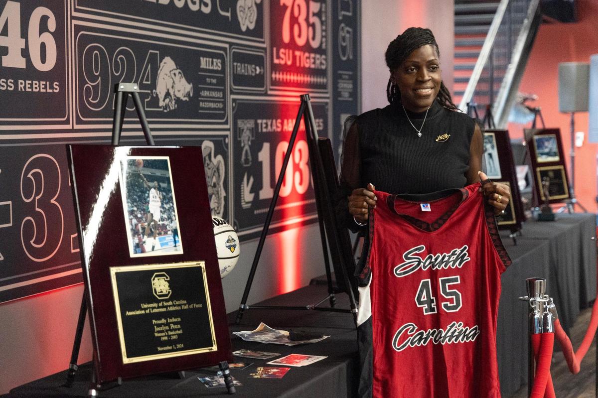 University of South Carolina’s Jocelyn Penn, a former Gamecocks basketball star, poses for photographs before she is inducted into the university’s hall of fame at Williams-Brice Arena on Friday, November 1, 2024.