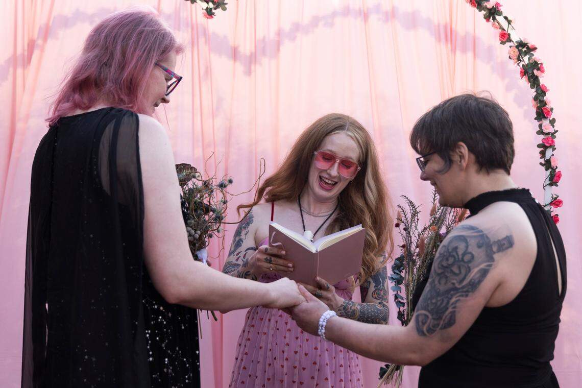 Y’all-Mart Caitlyn Viars marries Christine Fowler and Sharon Thrailkill during the artist flea market’s “mass gay wedding” at Art Bar in Columbia, South Carolina on Sunday, February 9, 2025. Fowler and Thrailkill had their first date at Y’all-Mart and are friends with Viars.