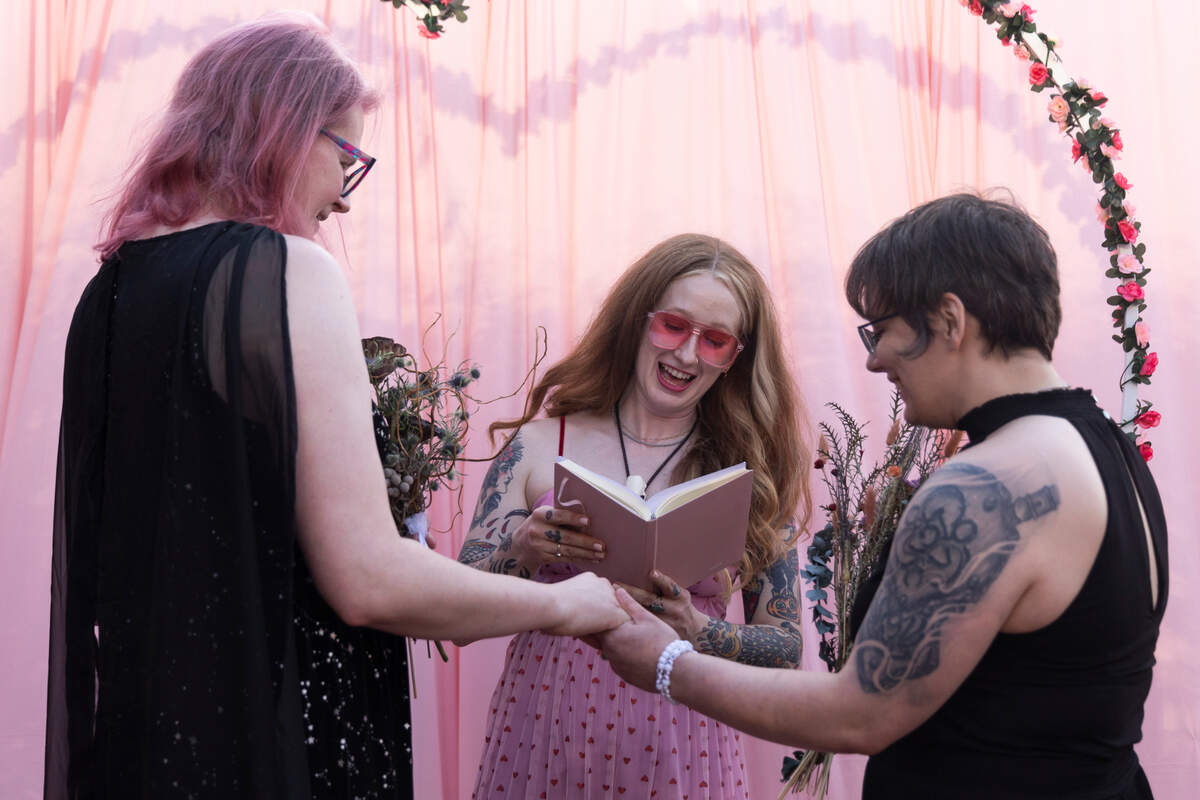 Y’all-Mart Caitlyn Viars marries Christine Fowler and Sharon Thrailkill during the artist flea market’s “mass gay wedding” at Art Bar in Columbia, South Carolina on Sunday, February 9, 2025. Fowler and Thrailkill had their first date at Y’all-Mart and are friends with Viars.