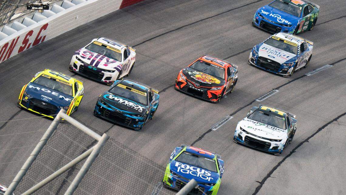 Erik Jones (43), Ross Chastain (1), Ryan Blaney (12), Alex Bowman (48), Martin Truex (19), Kevin Harvick (4) and Ricky Stenhouse Jr. (47) compete in the NASCAR Southern 500 auto race Sunday, Sept. 4, 2022, in Darlington, S.C. Jones won the race after taking the lead from Kyle Busch when Busch blew a motor with 30 laps remaining in the race. (AP Photo/Sean Rayford)