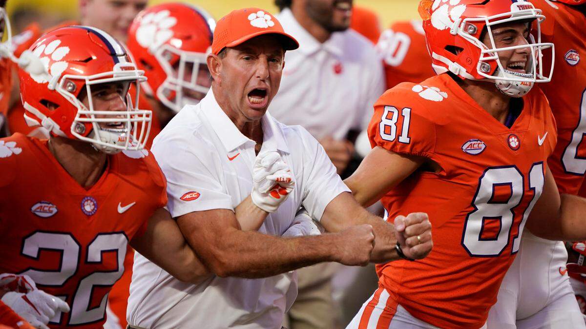 Clemson coach Dabo Swinney joins players before the team’s NCAA college football game against Georgia on Saturday, Sept. 4, 2021, in Charlotte, N.C.