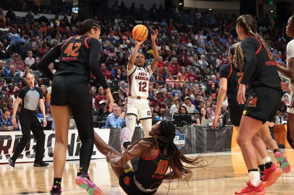 University of South Carolina’s MiLaysia Fulwiley (12) shoots as Maryland Terrapins’ Mir McLean (10) falls during the first half of action at the Legacy Arena in Birmingham on Friday, March 28, 2025 in the Birmingham 2 regional of the NCAA Tournament.