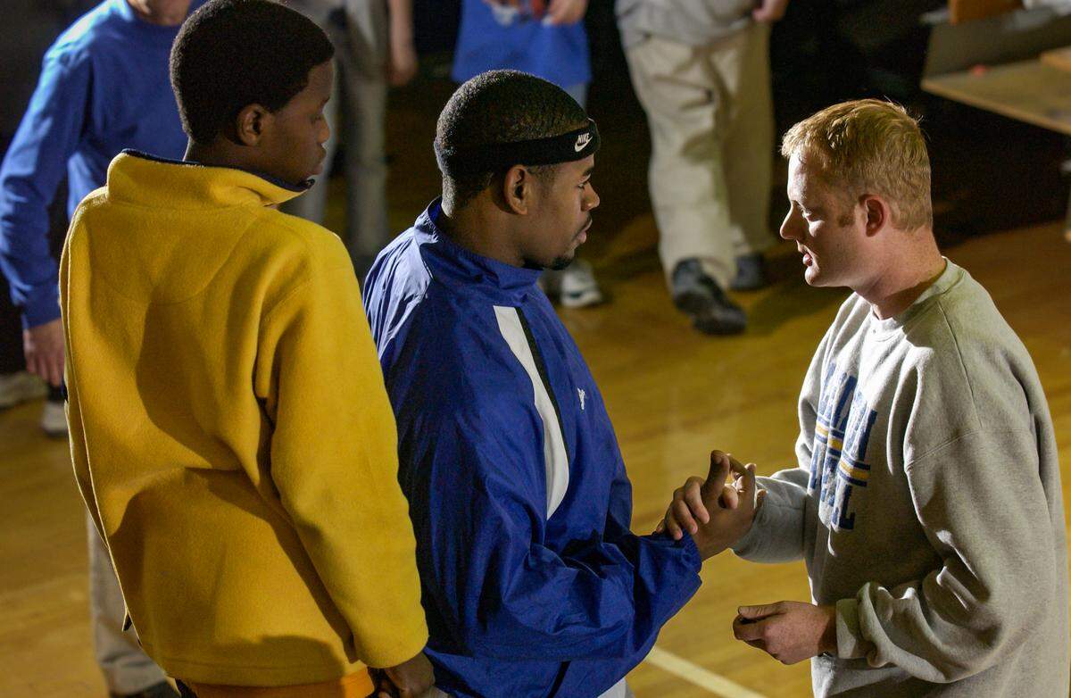 Chad Staggs, pictured here with Demetris Summers at a Lexington High School basketball game, worked hard behind the scenes to keep Summers on track with such things as grades and simply getting to school on time. And when Summers signed with the University of South Carolina, Staggs followed him and served a similar role to make sure Summers stayed in line.