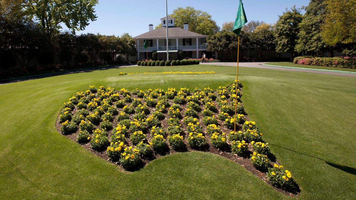 FILE - Flowers grace the entrance to the clubhouse at the Augusta National Golf Club as preparations continue for the Masters golf tournament in Augusta, Ga., on Sunday, April 3, 2011. The Masters starts Thursday, April 7, 2022 and the course at Augusta National is among the most famous in the world because it hosts the only major held in the same place. Most memorable is the back nine because of the two par-5 holes that can be reached in two. (AP Photo/Dave Martin, File)