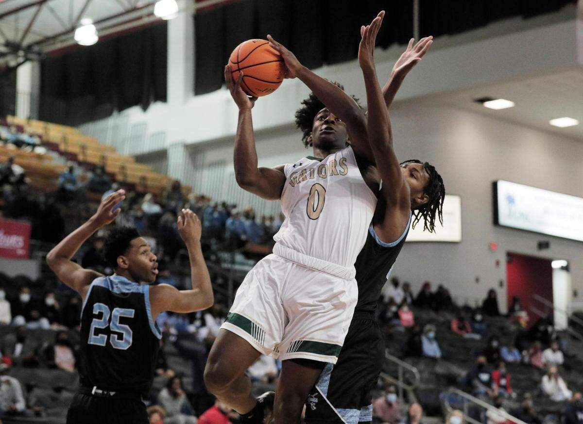 Dorman’s Noah Clowney (15) attempts to block River Bluff’s Myles Jenkins (0) in Aiken, South Carolina on Saturday, March 6, 2021.