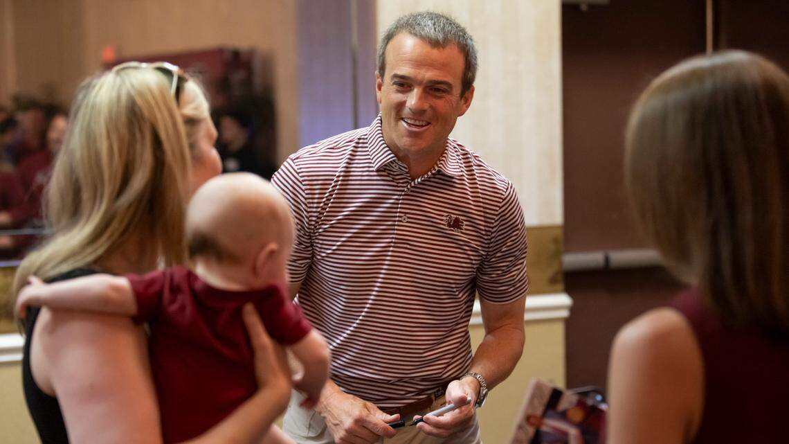 Football head coach Shane Beamer speaks with Lauren Carter, her son Waylon, 4-months, and Lesley Lawrimore during the Gamecock Welcome Home Banquet, organized by the Lexington and Richalnd County Gamecock Clubs, at Seawell’s in Columbia on Monday, May 8, 2023.