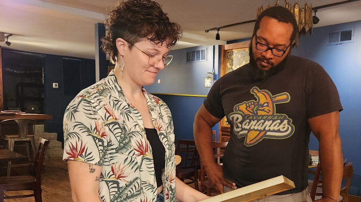 Chelsea Ford and Will Green, two of the owners of The Hoot bar and restaurant, discuss decor for the upcoming establishment. It plans to open in June at 2910 Rosewood Drive suite 1.