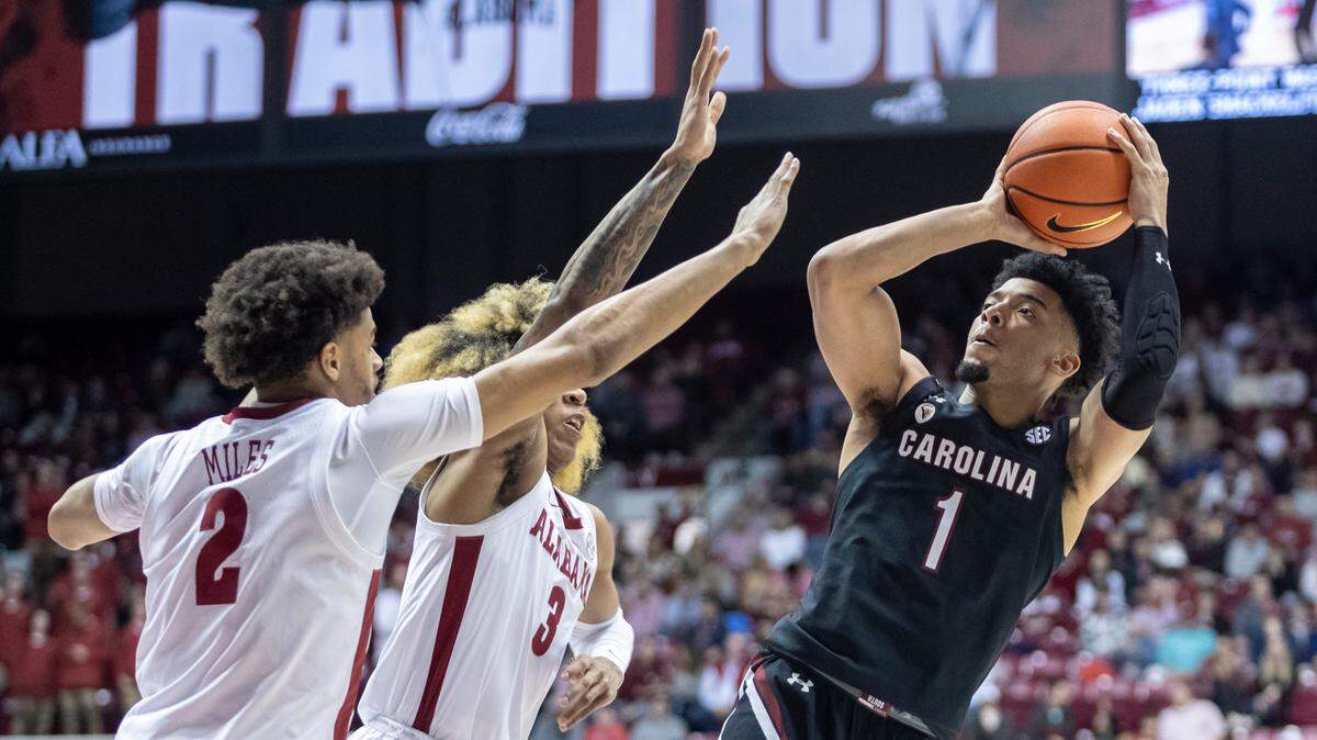 South Carolina guard Jacobi Wright (1) shoots with Alabama forward Darius Miles (2) and guard JD Davison (3) defending during the first half of an NCAA college basketball game, Saturday, Feb. 26, 2022, in Tuscaloosa, Ala.