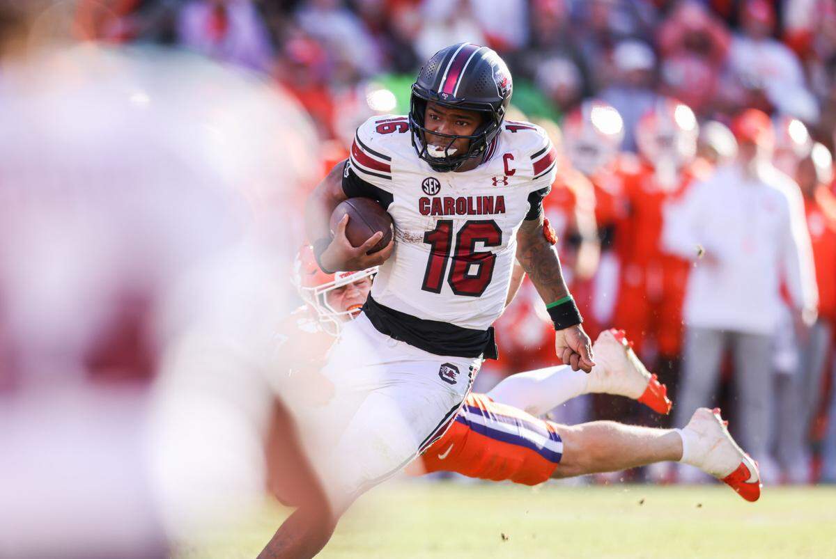 South Carolina quarterback LaNorris Sellers (16) carries the ball during the second half of the Palmetto Bowl between South Carolina and Clemson at Memorial Stadium in Clemson on Saturday, November 30, 2024.