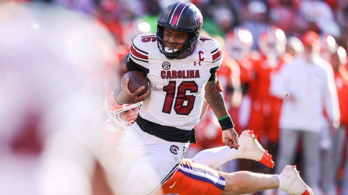 South Carolina quarterback LaNorris Sellers (16) carries the ball during the second half of the Palmetto Bowl between South Carolina and Clemson at Memorial Stadium in Clemson on Saturday, November 30, 2024.