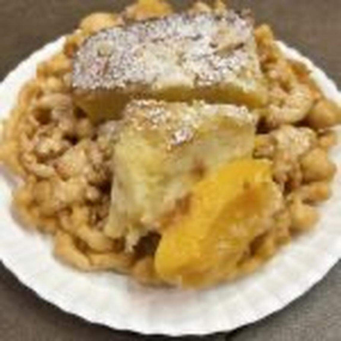 An image of peach cobbler funnel cake.